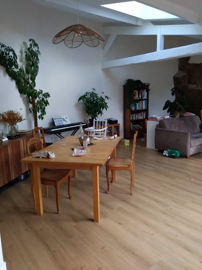 Dining room under exposed beams, before